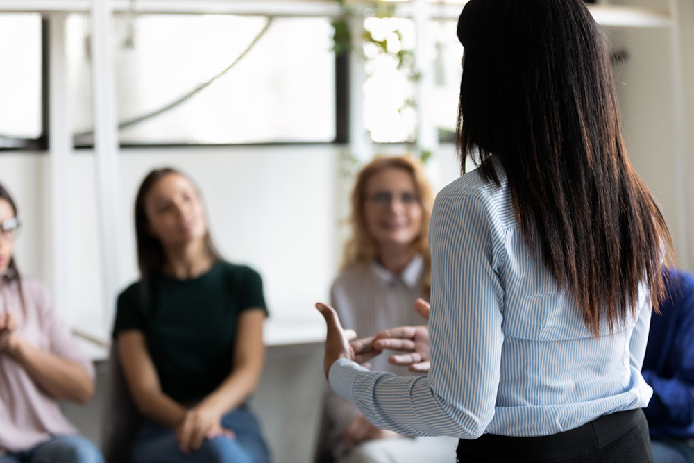 Woman presenting to a group of people